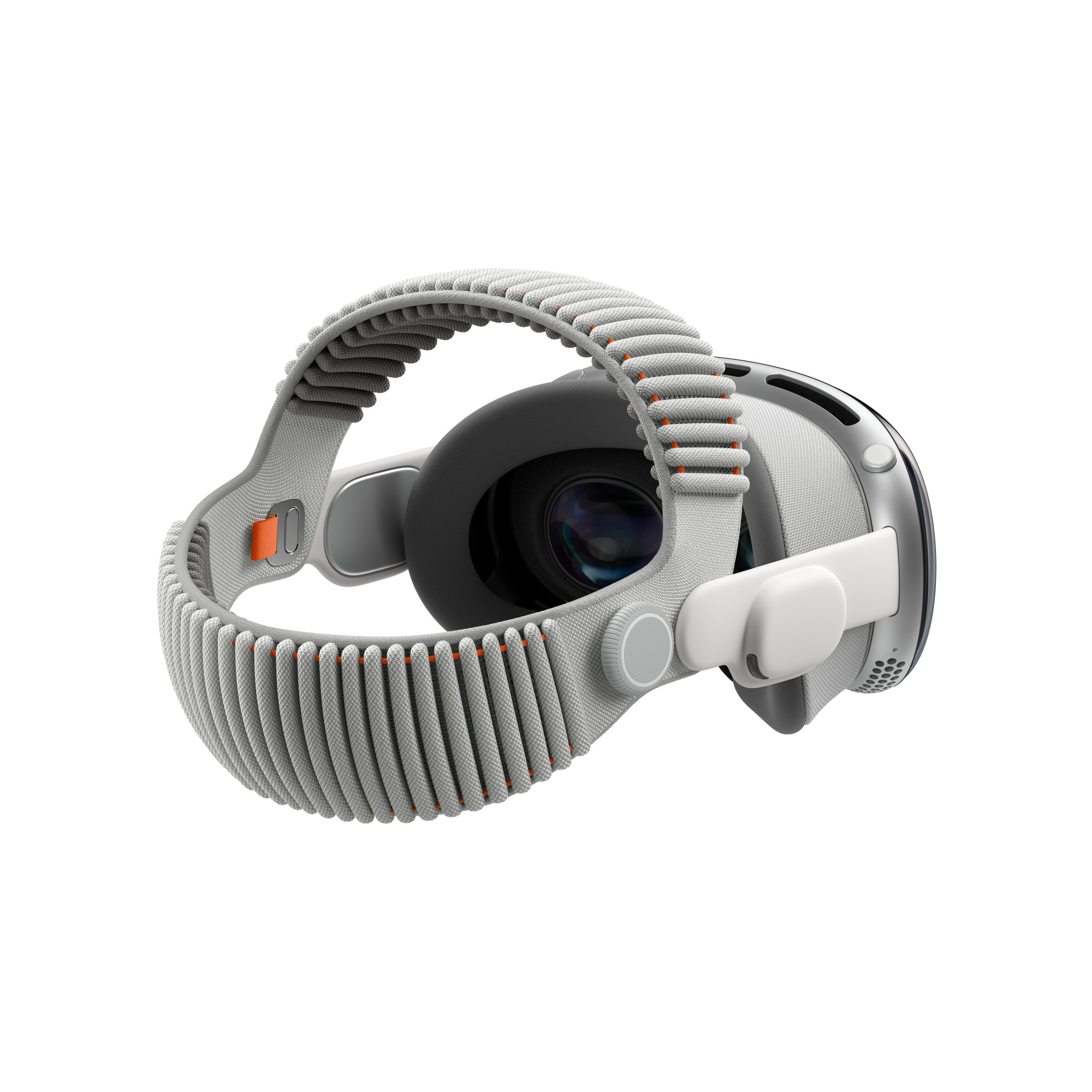 Dual Knit Band, крепится к ремешку Apple Vision Pro Audio, ребристая структура, два ремешка, верхний ремешок проходит сверху, нижний ремешок проходит за спиной, регулируемый Fit Dial с правой стороны, оранжевый язычок внутри